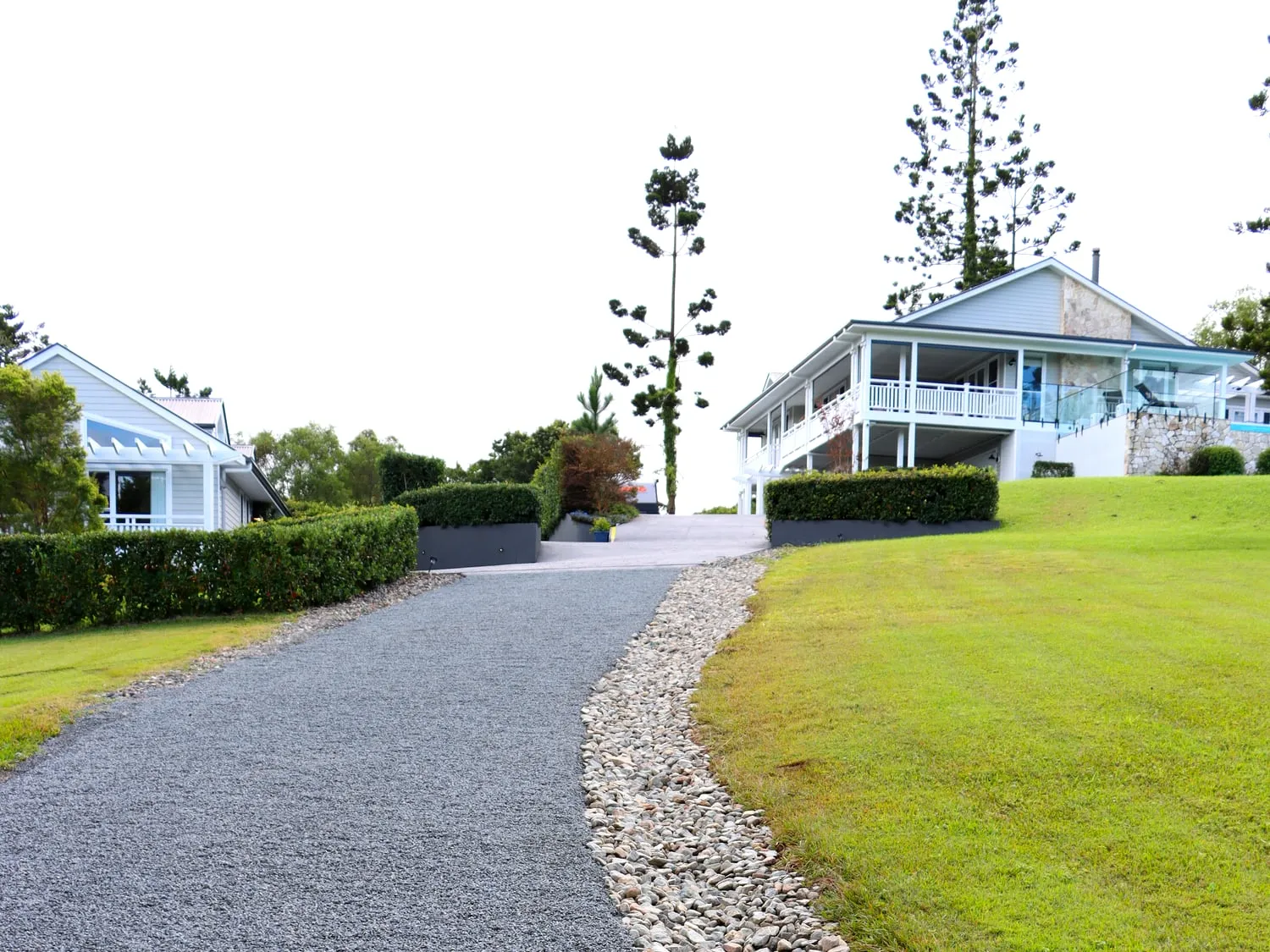 Finished driveway & river-stone border — Eumundi, by Adams Earthworx