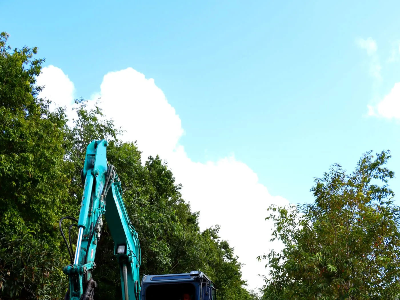 Excavator shaping the block — Eumundi, by Adams Earthworx