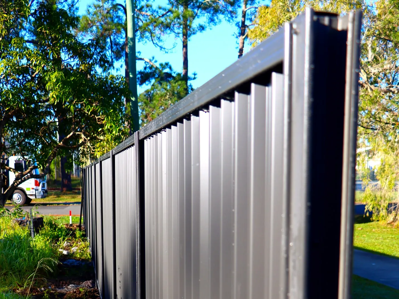 Colorbond fence line — Yandina, by Adams Earthworx
